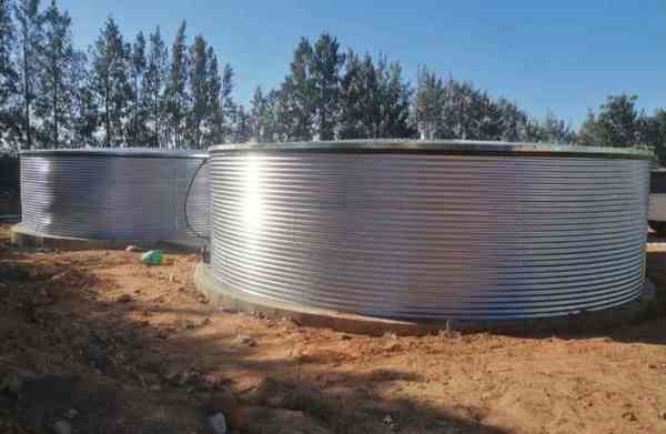 Twin galvanised steel water tanks installed by HYDROFLEX